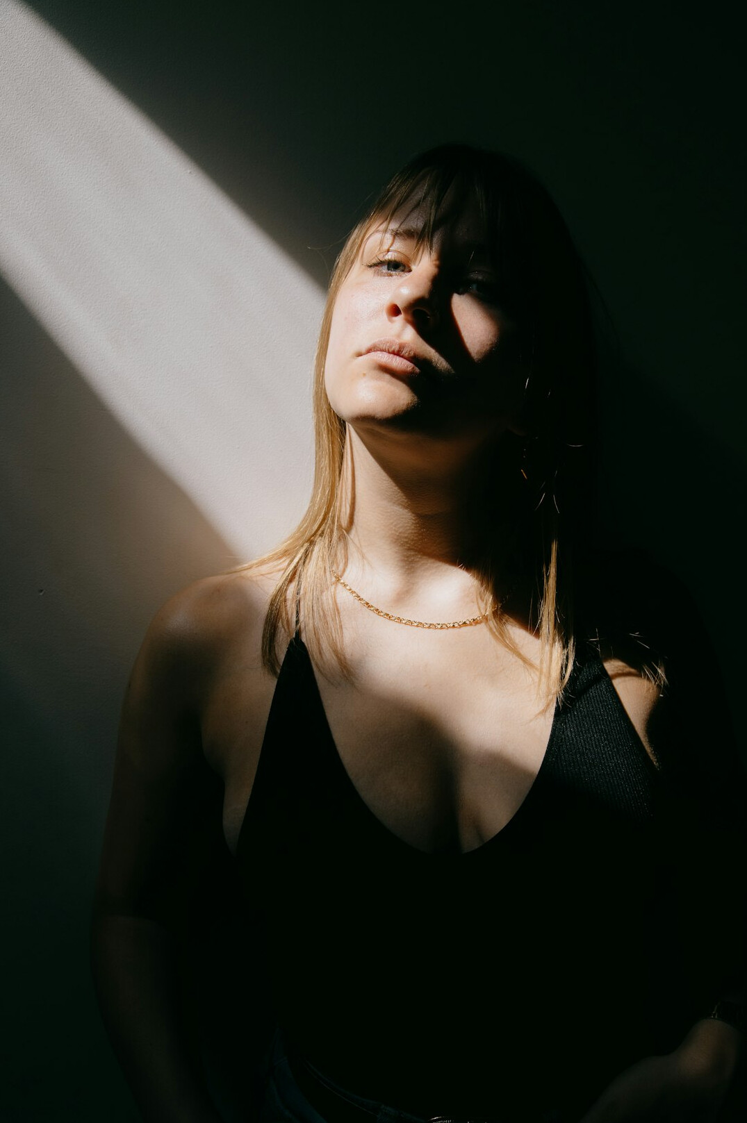 Smiling blonde woman in a light top portrait