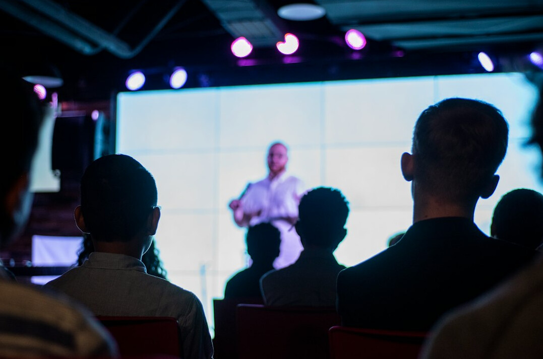 person giving presentation on stage