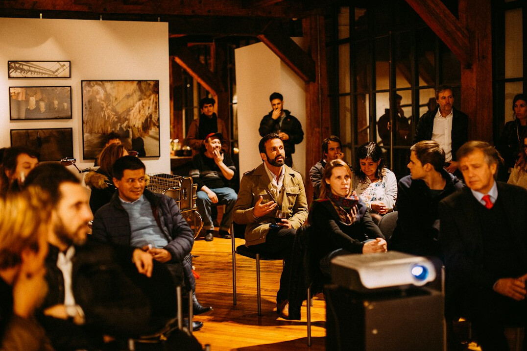 audience listening to speaker