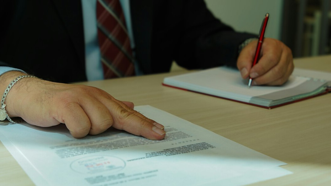 man negotiating contract