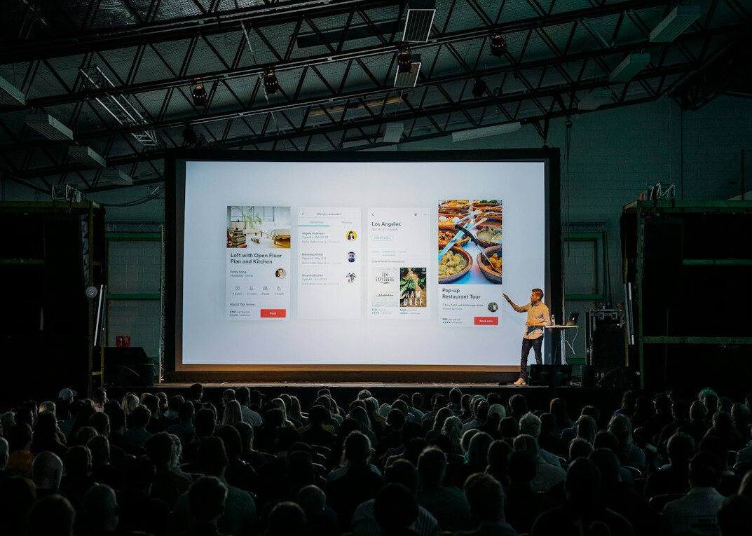person giving presentation on stage